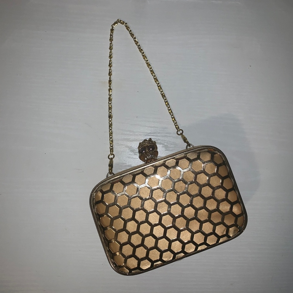 Small, gold skull clutch